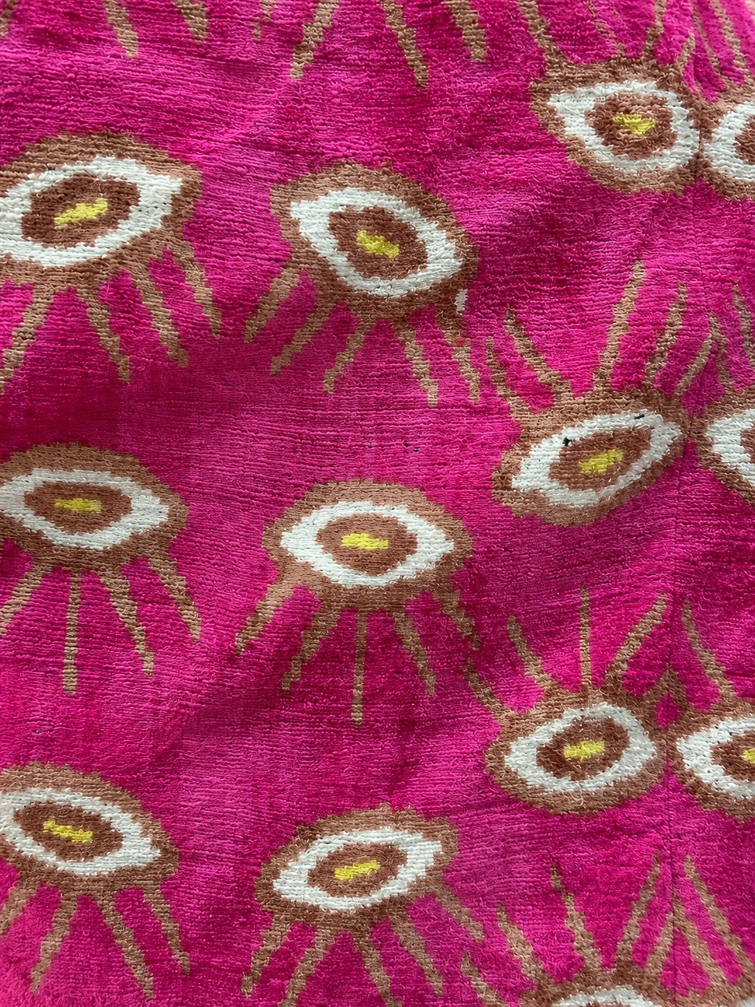 Handwoven Velvet Ikat Kaftan — fabric and embroidery detail, lighting-adjusted from a source photograph