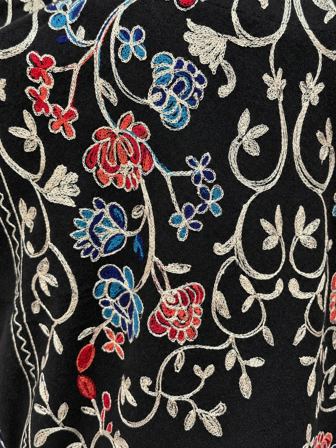 Cashmere Kaftan — fabric and embroidery detail, lighting-adjusted from a source photograph