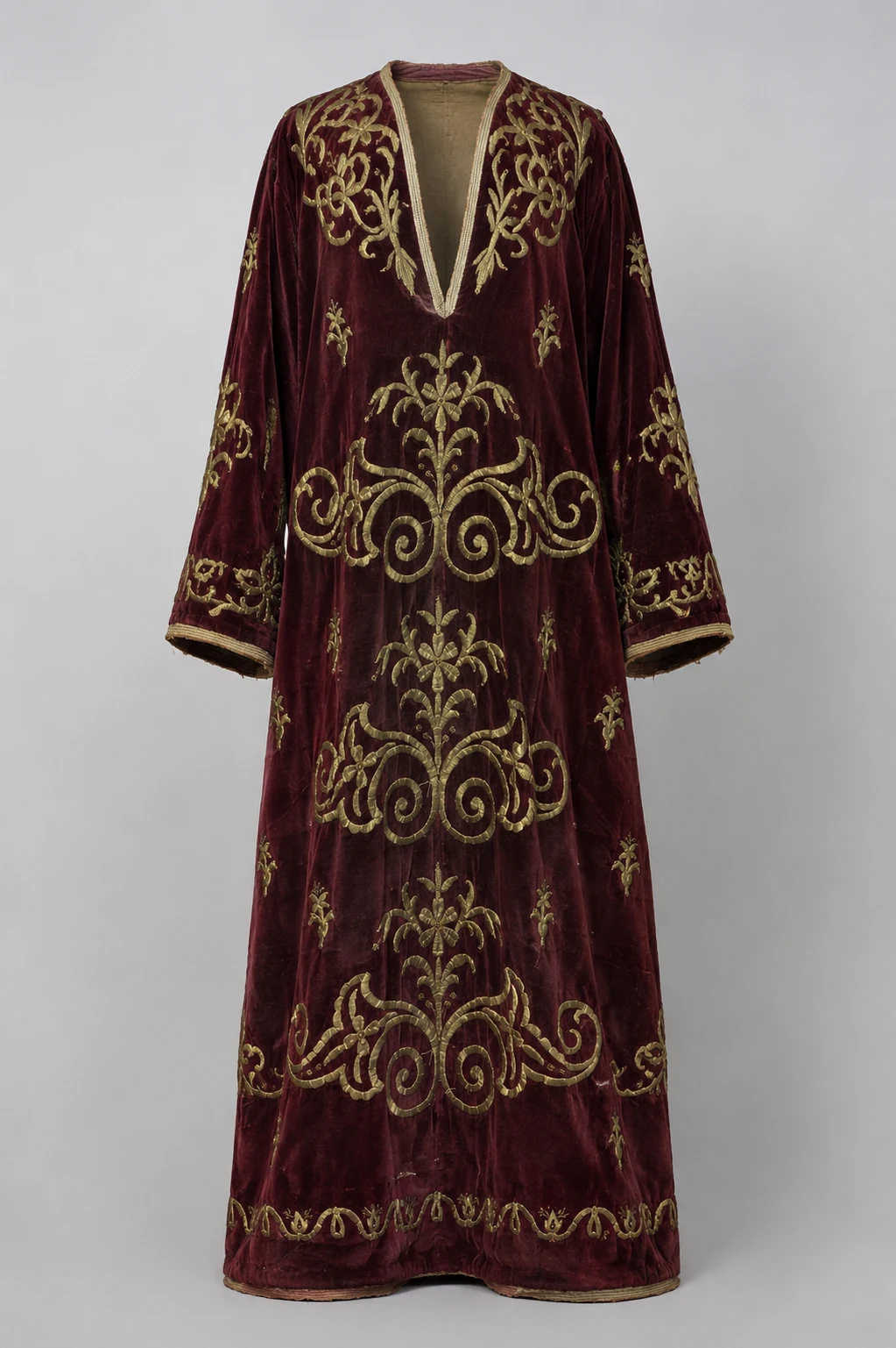 Burgundy velvet Anatolian sırma kaftan with hand-worked gold-toned floral embroidery